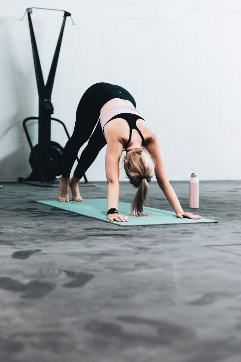 woman doing downward-facing dog yoga pose