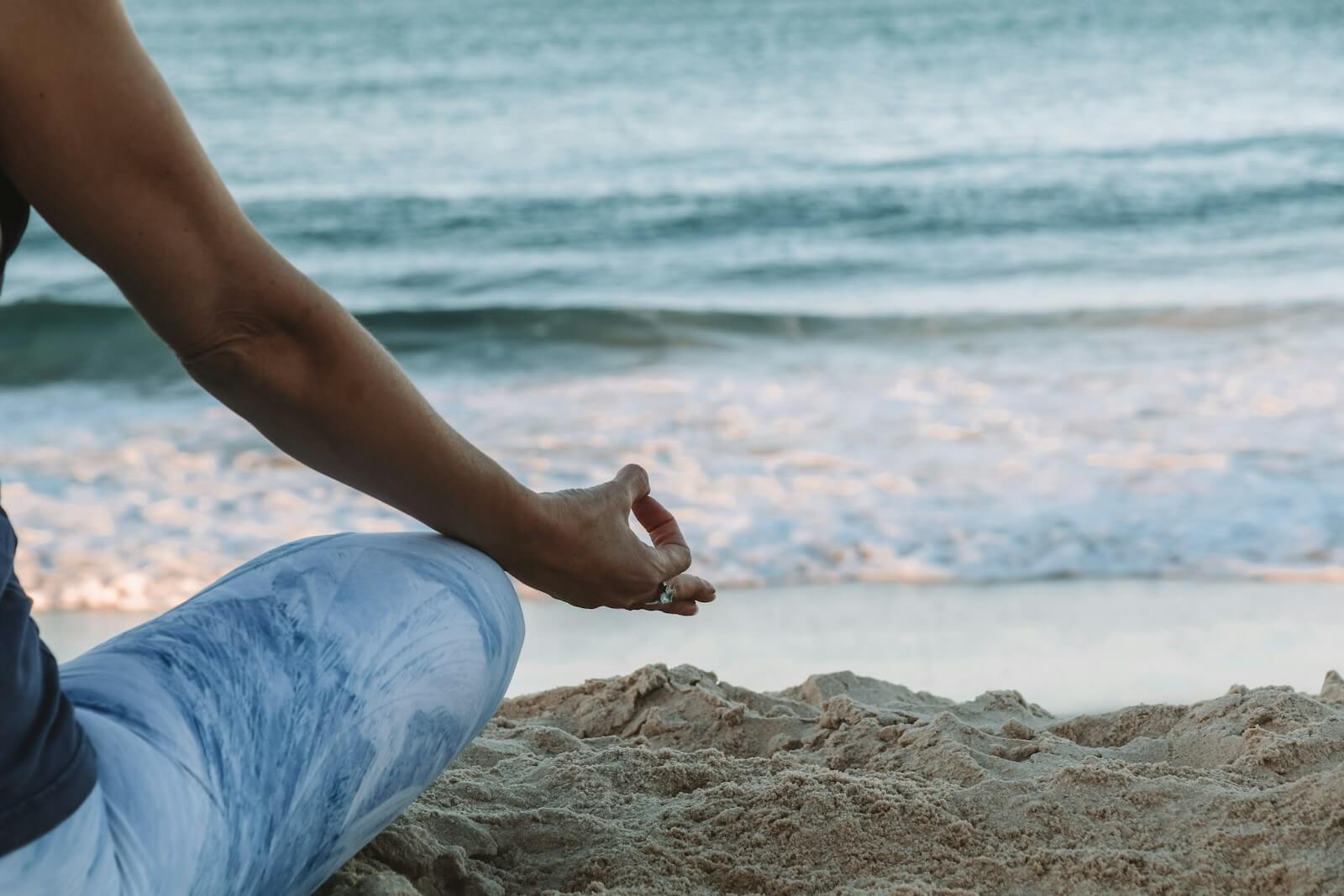 person meditation on beach shore
